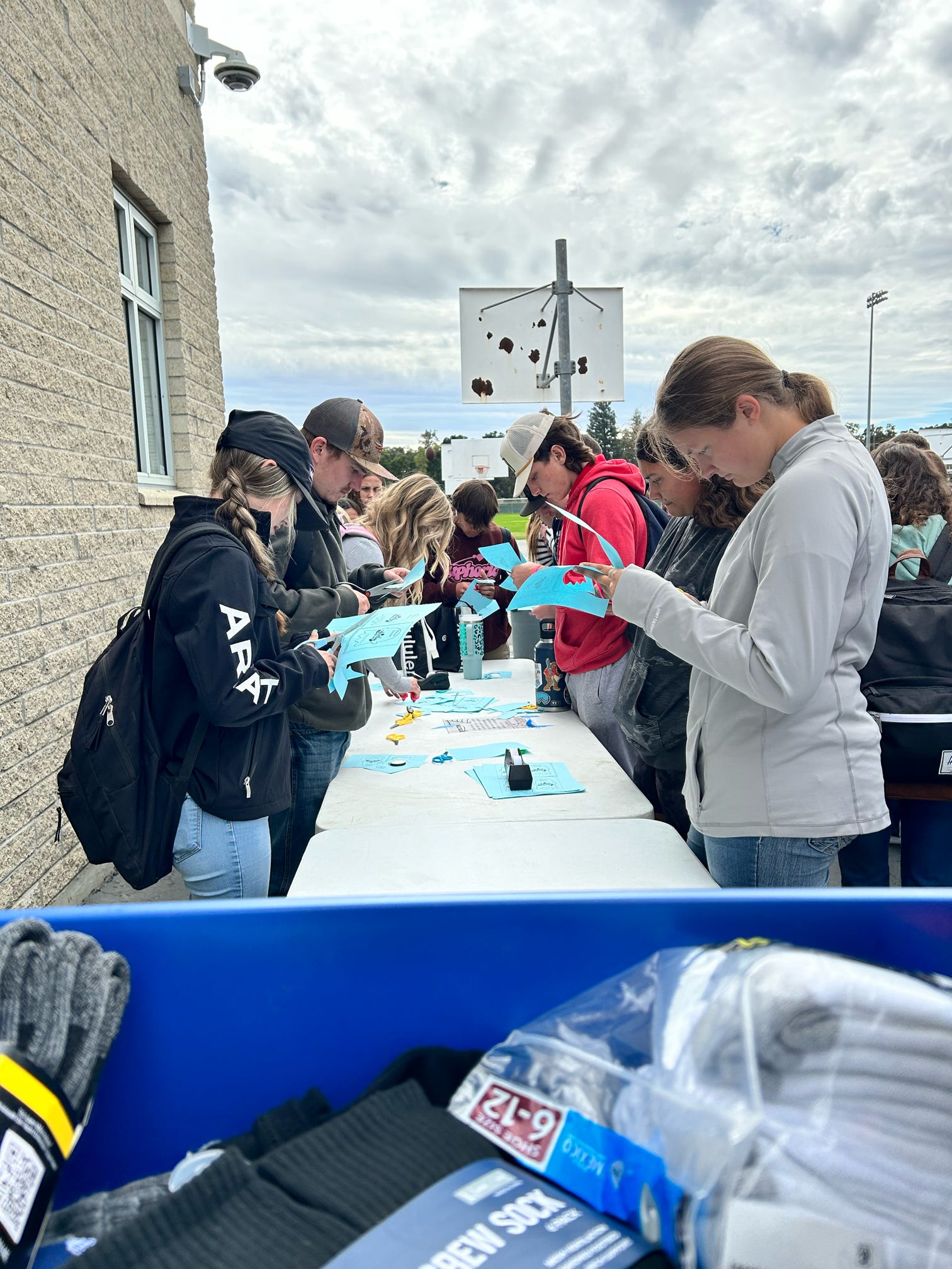 Photo of students assembling socks