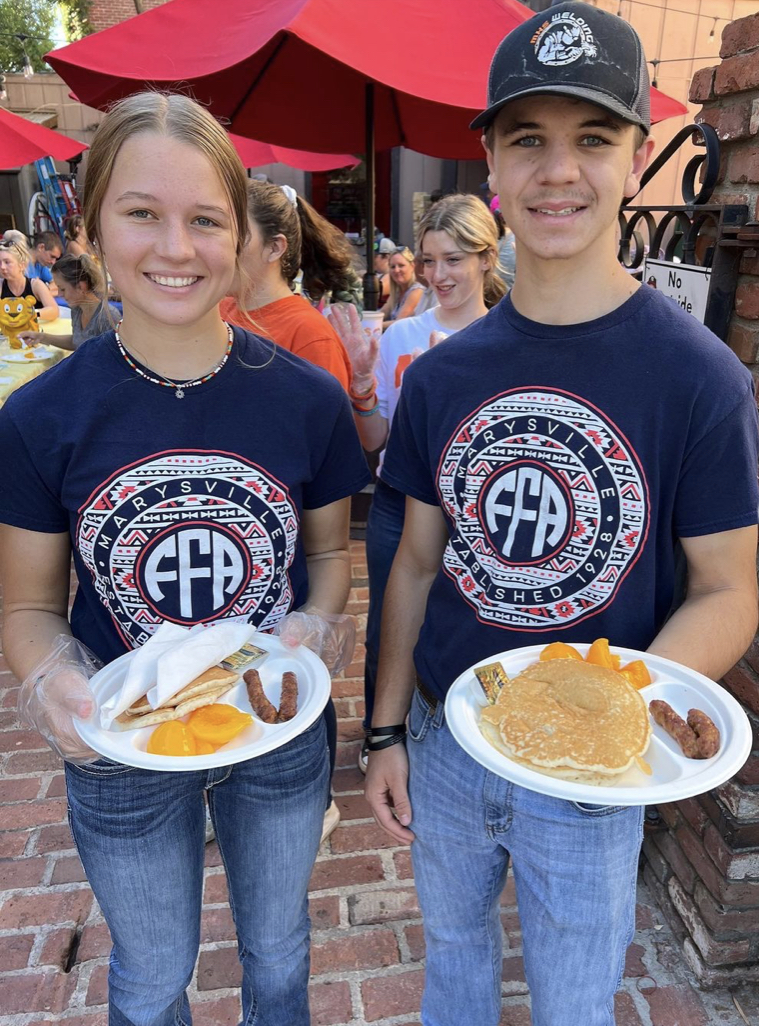 Members with pancakes