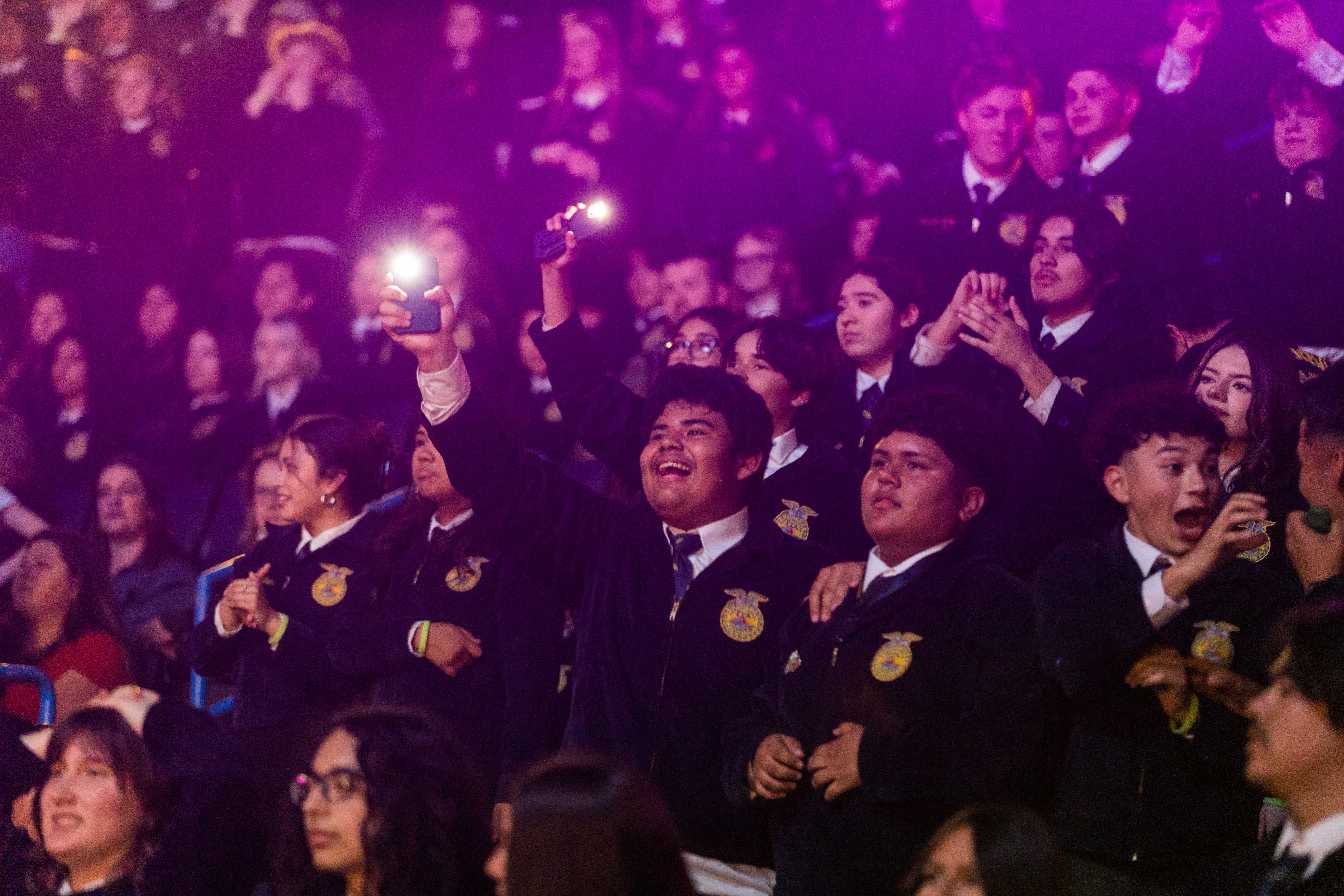 Members hold lighters during song