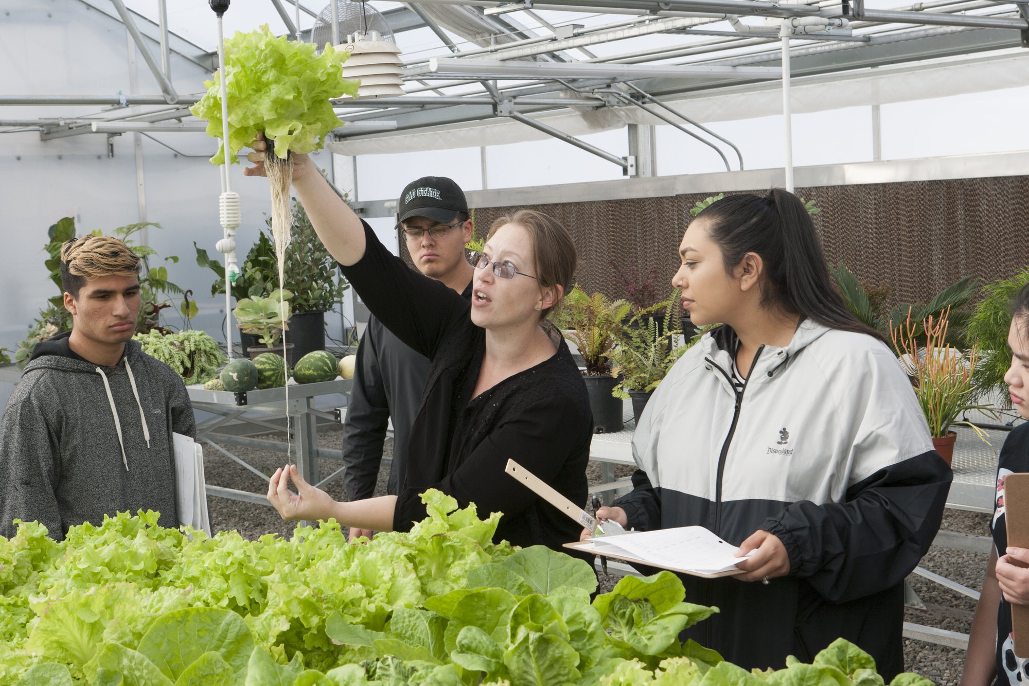 Students in greenhouse.