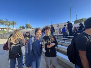 STUDENTS WITH FLOWERS